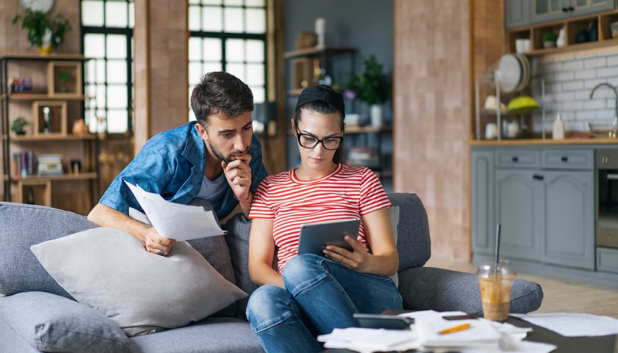 Couple looking at tablet.