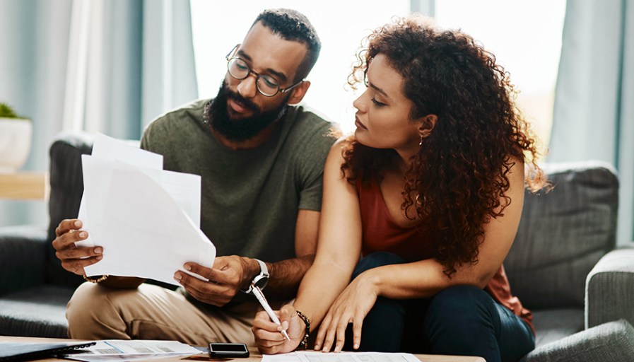 Couple looking at papers together.