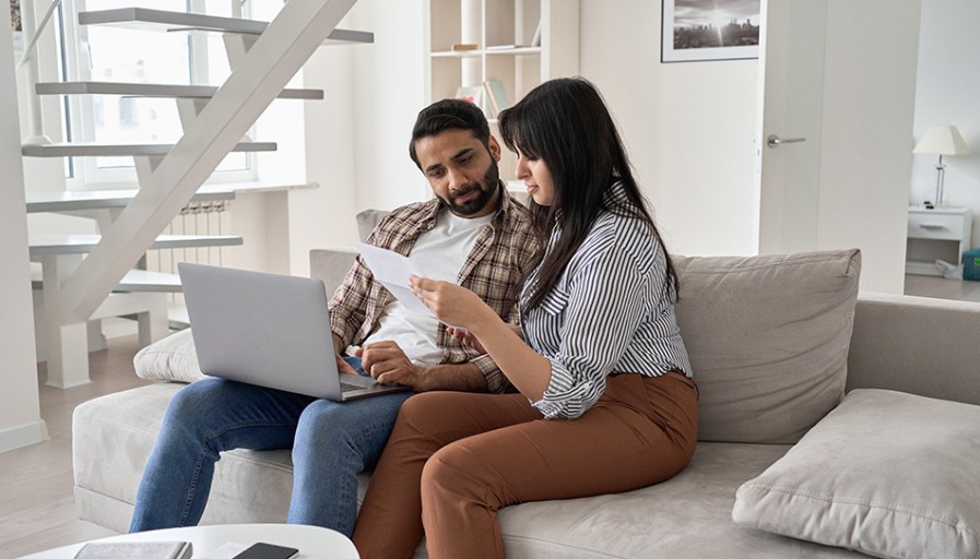 Couple looking at papers together.