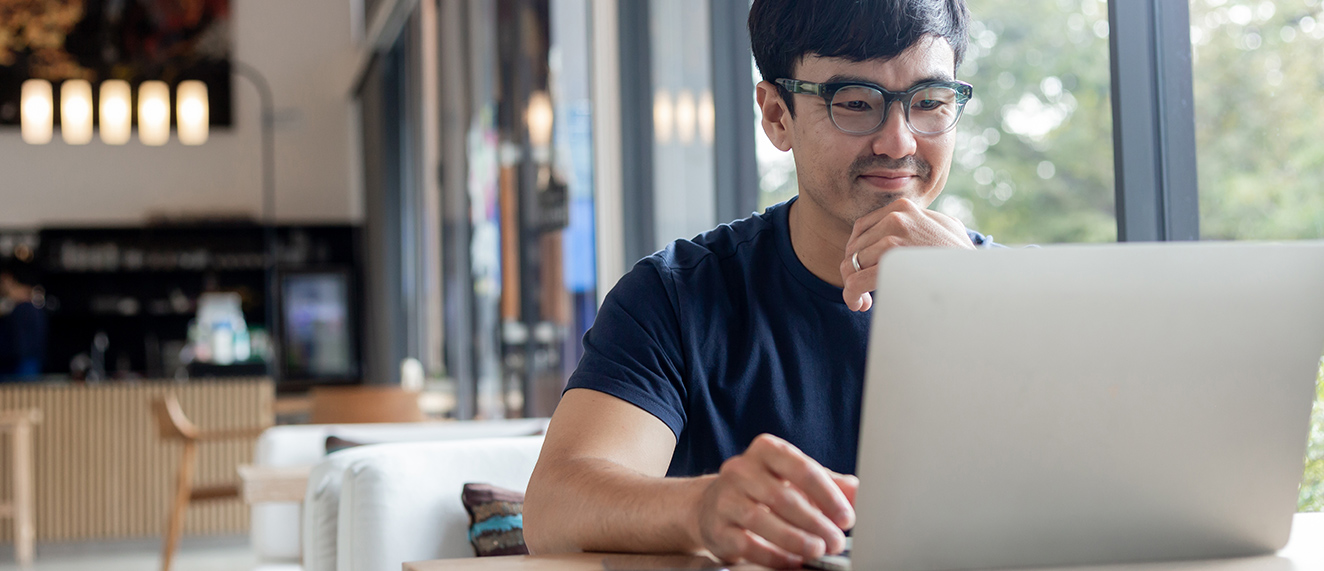 Man on computer.