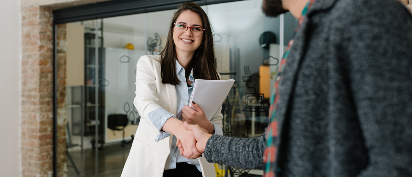 Two people shaking hands.